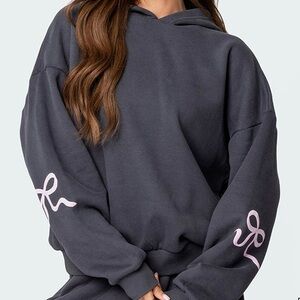Edikted charcoal Hoodie with Light Pink bows. Worn 2x. Currently sold for $88!